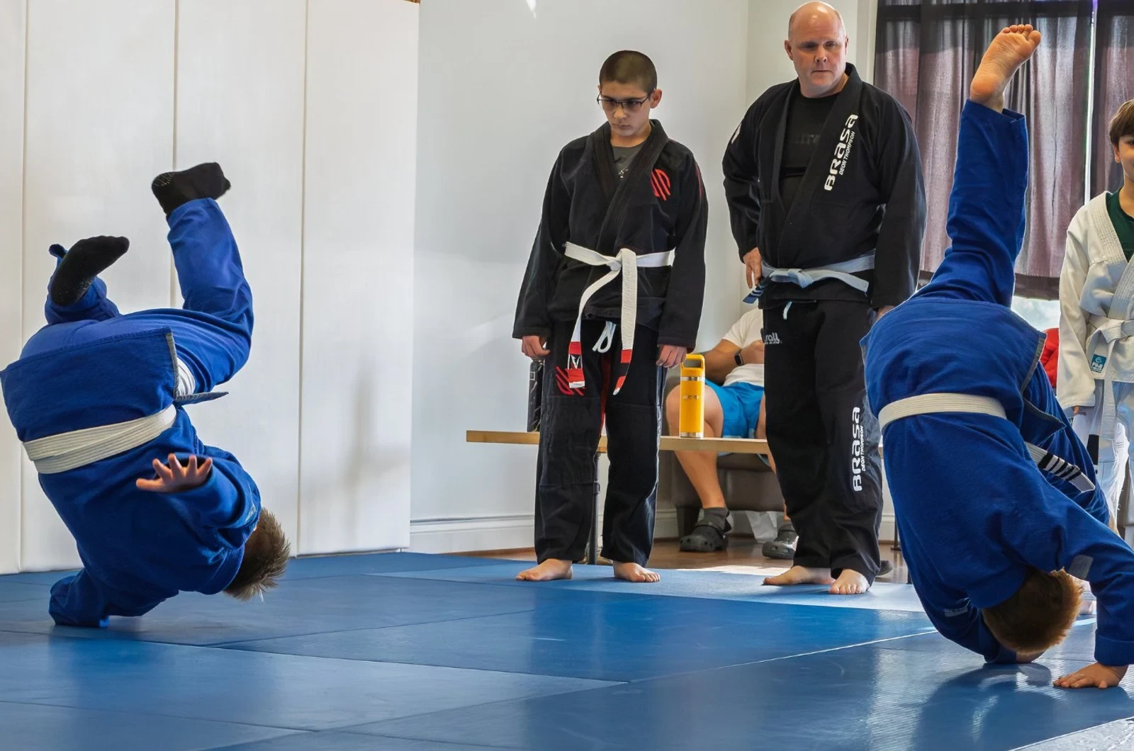 Kids learning takedowns at Jits 56 Brazilian Jiu-Jitsu